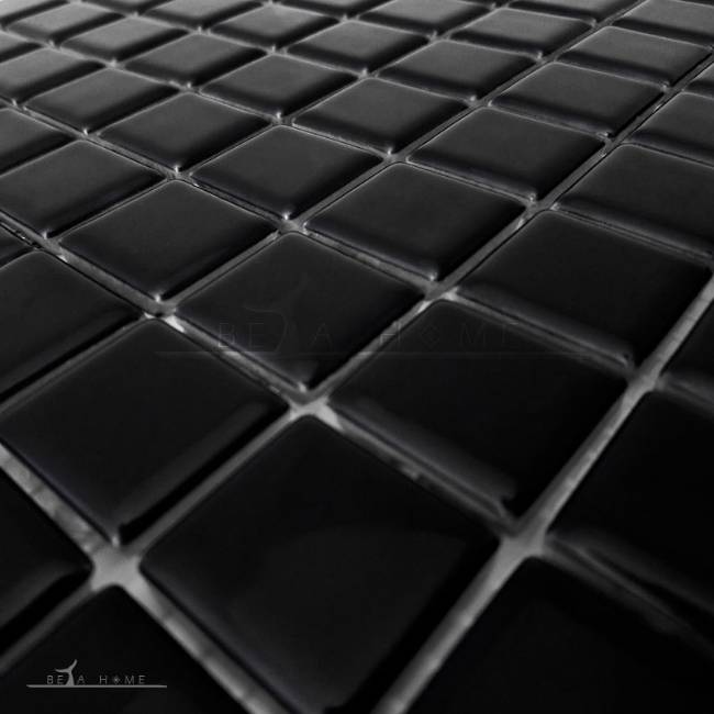 Close view of black glazed mosaic tiles