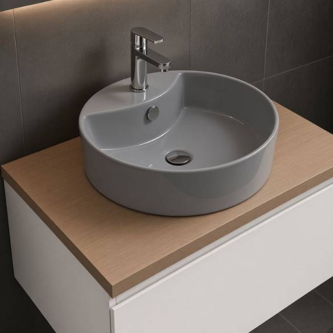 Grey Diana Morvarid countertop sink in a modern bathroom, front-left view