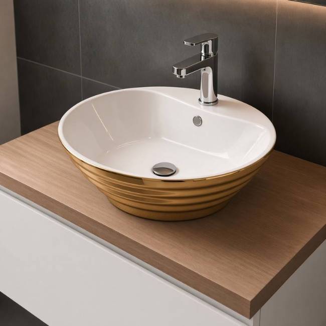 Morvarid Oriental countertop Gold sink in a modern bathroom, front-right view