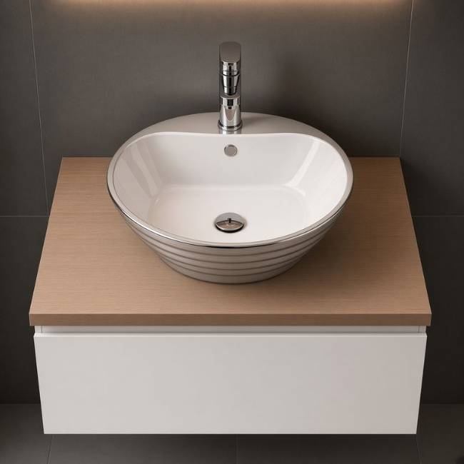 Oriental countertop Silver sink in a modern bathroom, front view